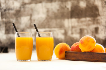 two peach juice glasses