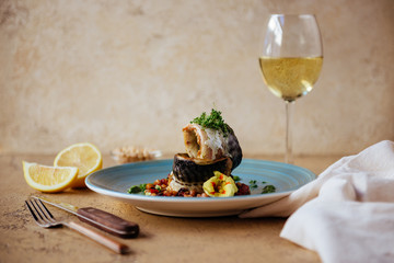 Smoked tasty mackerel with lemon on wooden background