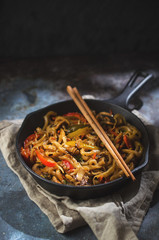 udon pasta with vegetables on skillet