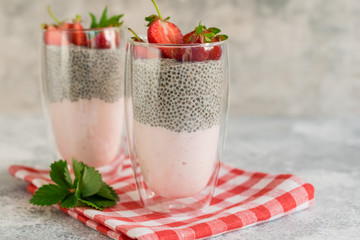 Beautiful and tasty dessert with strawberry and chia seeds. A fresh pudding with fruit for breakfast