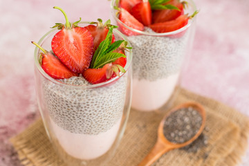 Beautiful and tasty dessert with strawberry and chia seeds. A fresh pudding with fruit for breakfast