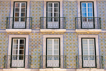 Old balconies and mosaic tiles on building, popular and famous view in Lisbon, Portugal 