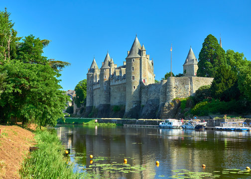 Landscape view of the of the Oust river and the chateau castle of the medieval village of Josselin, Morbihan Department, Brittany Region, France