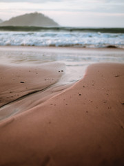 Little water stream leading to the shore