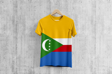 Comoros flag T-shirt on hanger, Comoran team uniform design idea for garment production. National wear.