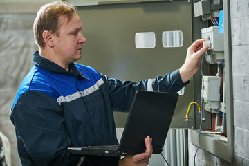 Electricity power control and metering. Worker collects data
