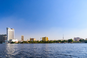 Fototapeta premium Residential and office buildings of the Cairo city. View from Nile river