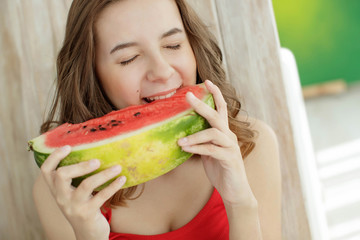 Beautiful and bright girl with watermelon. 