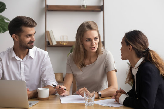 Professional company staff negotiating sitting together in office