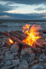 fire burns near the sea