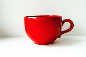 Red big cup. Isolated on light background.