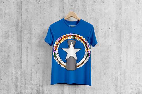 Northern Mariana Islands flag T-shirt on hanger, team uniform design idea for garment production. National wear.