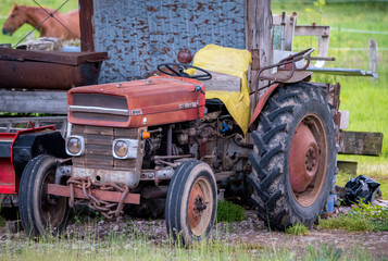 old red tractor in a farm