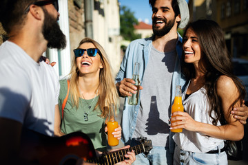 Group of young friends having fun together outdoor