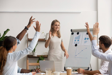 Caucasian female executive manager presenting new project, colleagues voting