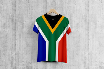 South Africa flag T-shirt on hanger, African team uniform design idea for garment production. National wear.