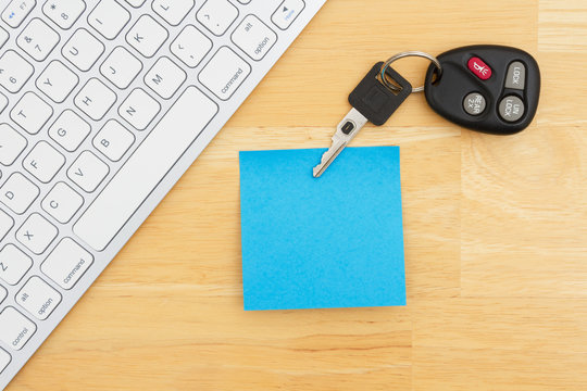 Car keys with a keyboard with blank sticky note