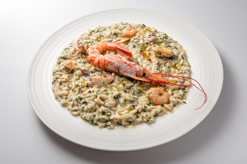 Risotto dish with spinach prawns and seafood