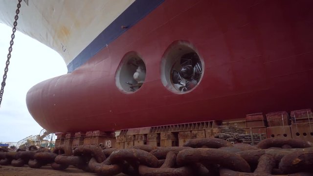 Ship during a drydock renovation with a huge rusty anchor chain