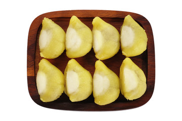 Durian mochi or mooncake or Durian daifuku on wood chop isolated on white background. This image stacked with clipping path, Mooncake for Mid autumn festival, Chinese happy new year and Moon festival.