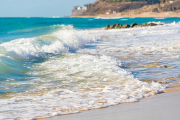 Sea surf on a sandy beach Canary Islands