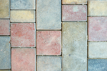 Stone pavement texture. Granite cobblestoned pavement background. Abstract background of old cobblestone pavement close-up