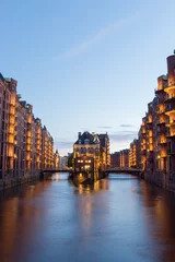 Illuminated water castle in Hamburg's old warehouse district © evahh