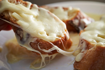 Baguette slice with melting cheese