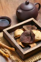chinese dried tangerine peel in wooden box with tea
