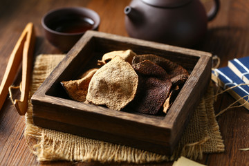 chinese dried tangerine peel in wooden box with tea