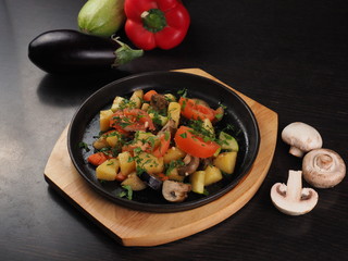 Champignon mushrooms with potato and tomato