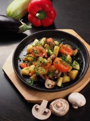 Champignon mushrooms with potato and tomato