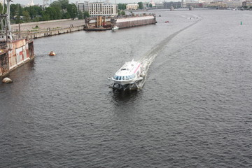 view from the bridge to the Neva river and boats of St. Petersburg   