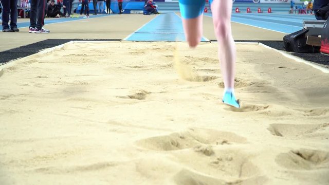 Athlete practicing high jump at sports venue 4k