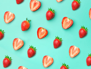Strawberry. Pattern of strawberrys on colored background. Fresh natural strawberry cut into pieces. Strawberry of different shapes