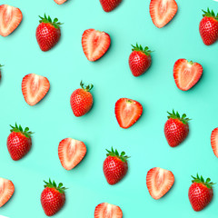 Strawberry. Pattern of strawberrys on colored background. Fresh natural strawberry cut into pieces. Strawberry of different shapes
