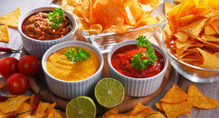 Composition with bowl of potato chips.