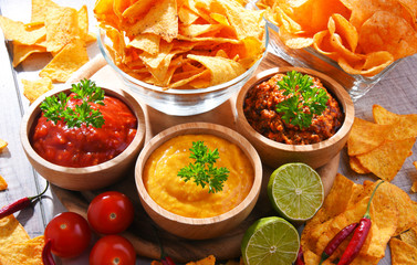 Composition with bowl of potato chips.
