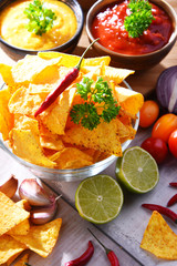 Composition with bowl of potato chips.