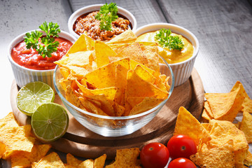 Composition with bowl of potato chips.