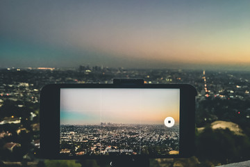 Los Angeles View Through Mobile Which Recording Sunset And Have Focus On Downtown From Griffith...