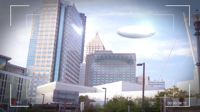 A UFO appears in a city near skyscrapers - Handheld Footage - V1