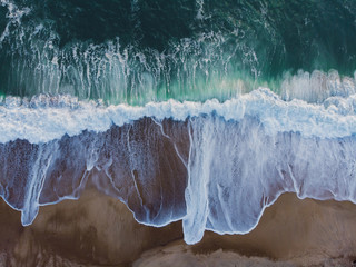 Seashore waves crashing from above