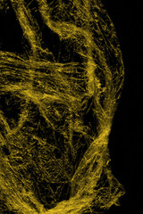 Transparent yellow plastic wrap on the black background. Plastic shopping bag texture. Reusable trash and waste.