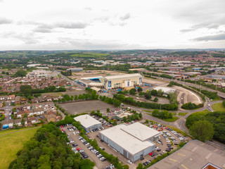 Fototapeta na wymiar Aerial photo over looking the whole of Leeds from the Beeston area of the City Centre in West Yorkshire, the photo also shows the Elland Road Leeds United football stadium in the background.
