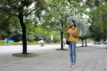 Fototapeta na wymiar woman with umbrella in town