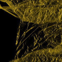 Transparent yellow plastic wrap on the black background. Plastic shopping bag texture. Reusable trash and waste.