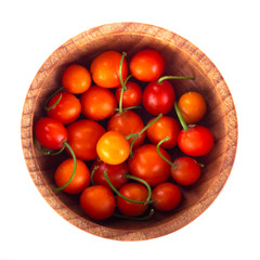 heap of may lily in wooden cup isolated on white background. top view