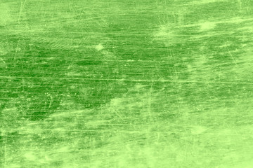 Grunge, dirty, scratched, unevenly colored green background.