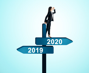 Woman on 2019, 2020 sign